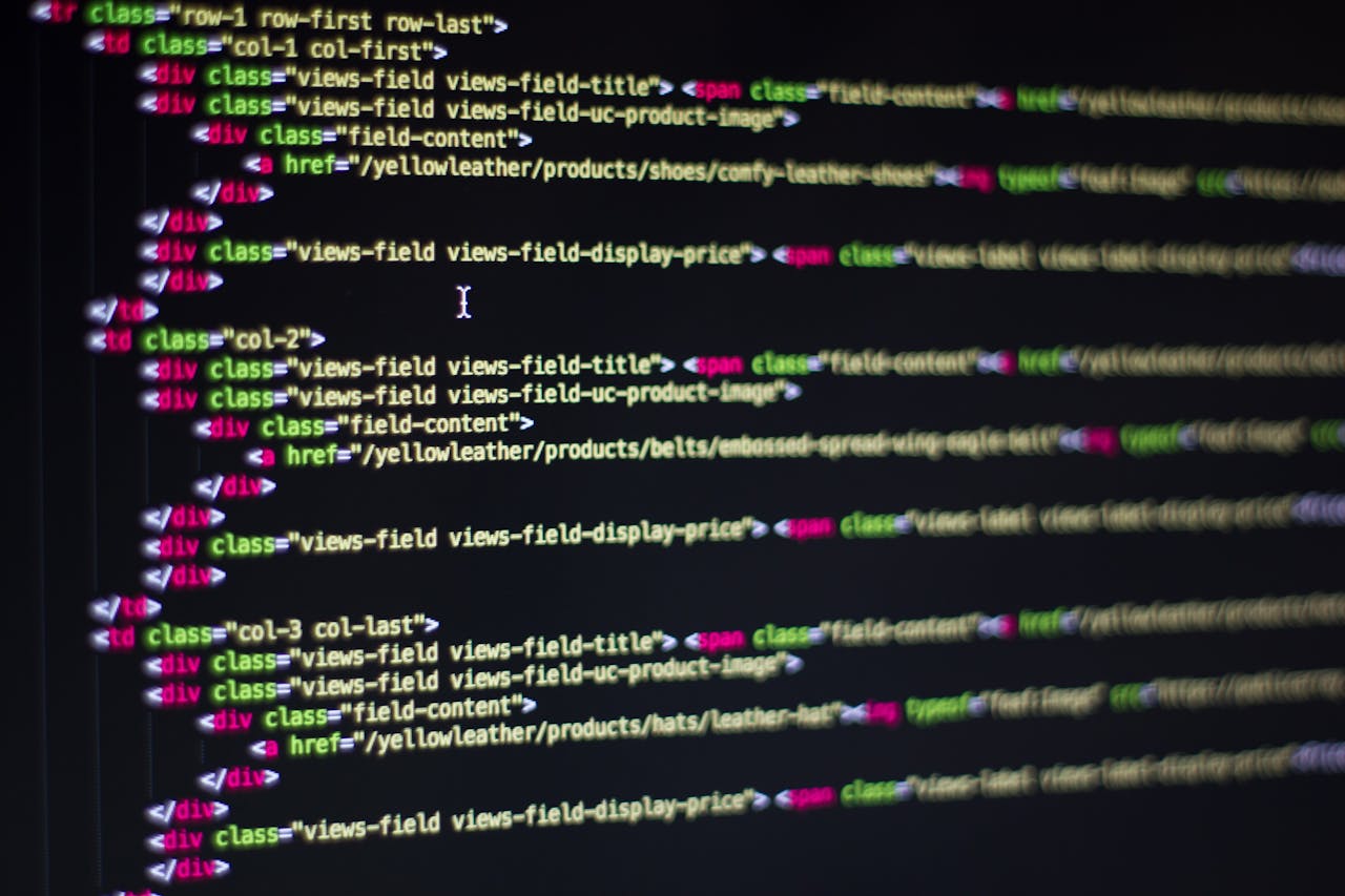 hero-img-01 Detailed close-up of HTML code on a computer monitor, showcasing web development.